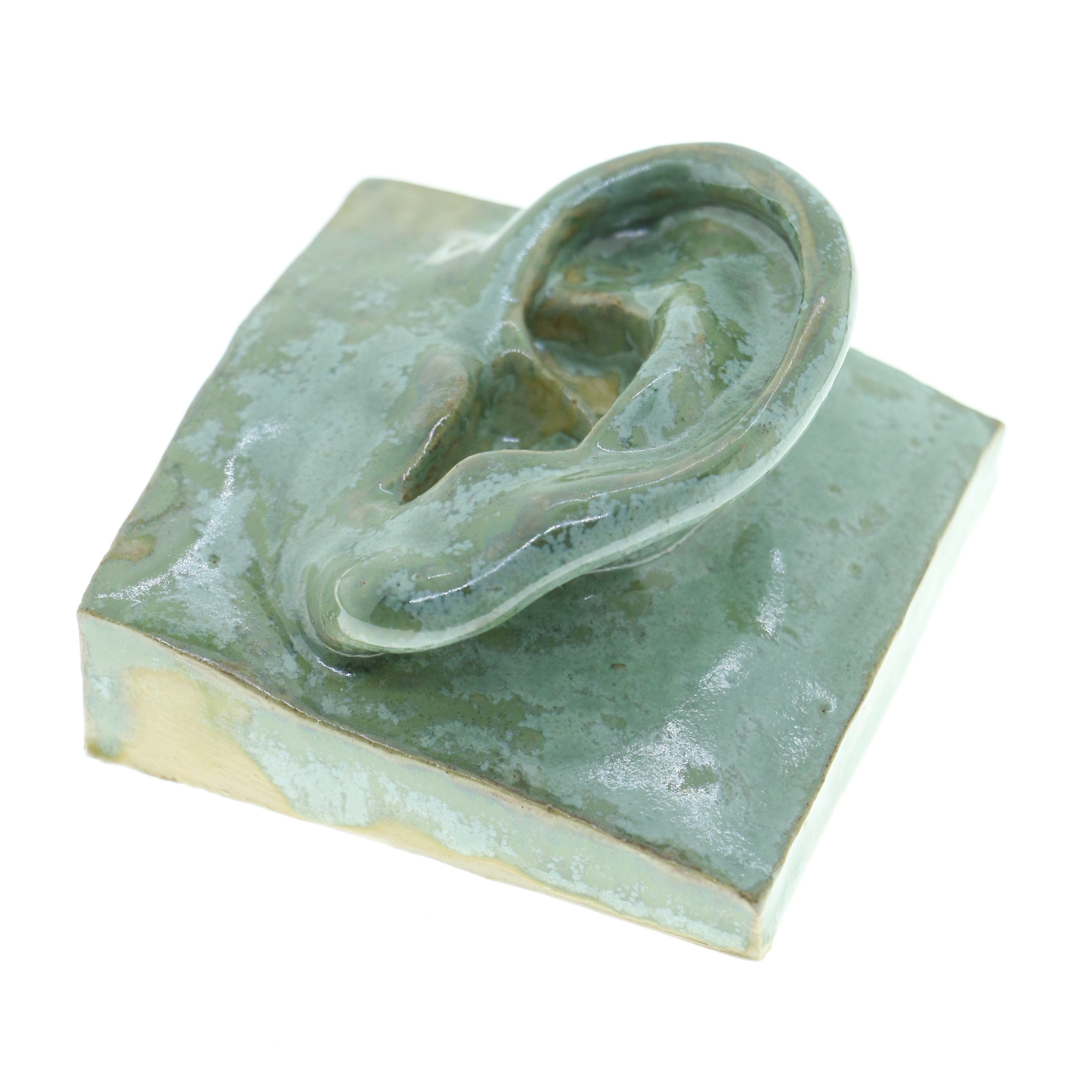 Jacob Laoru | Square Eye (Left): Firkantet øre i glaseret stentøjsler i CopperGreen til væggen Studio Hafnia