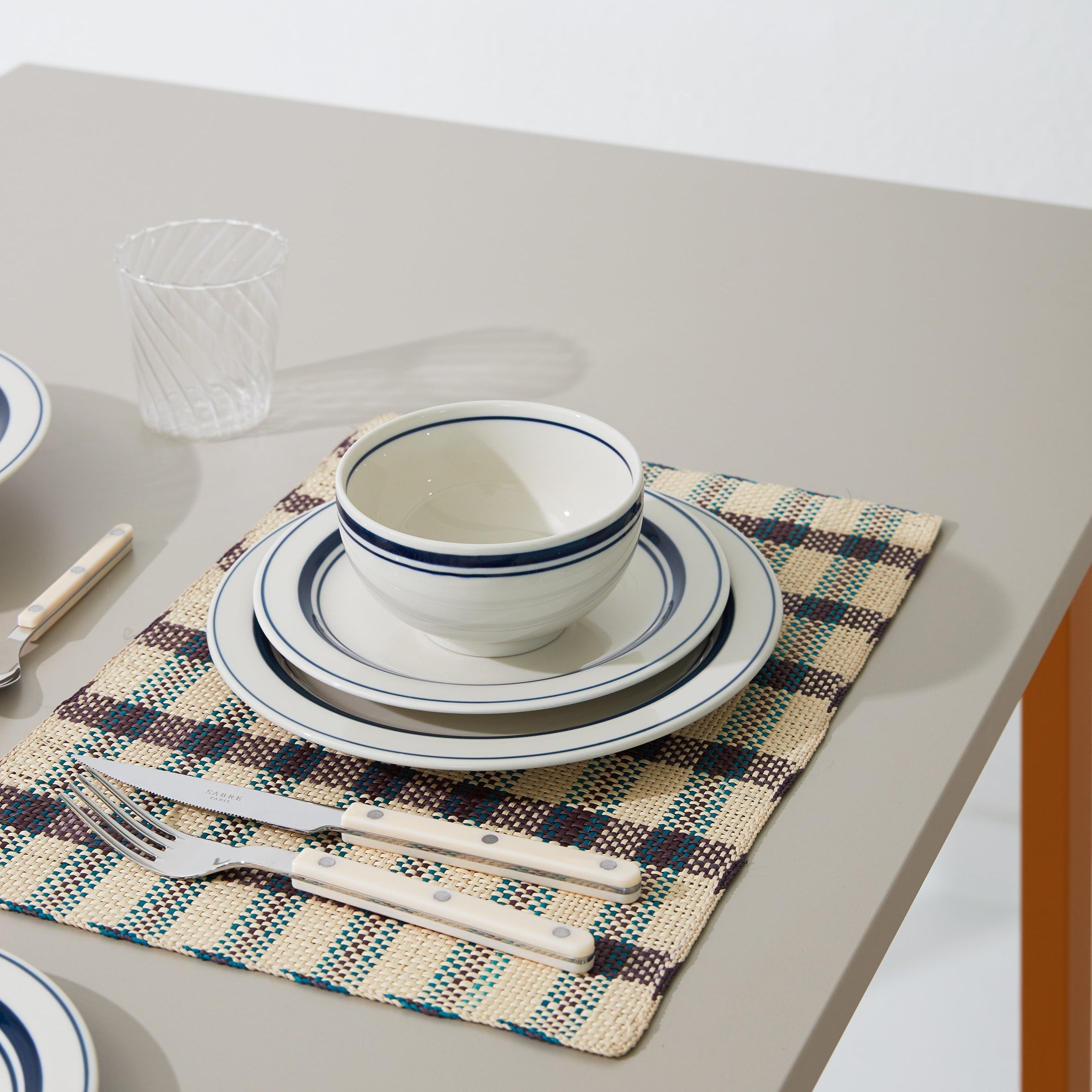 Japanese ceramic plates and bowl with blue rim on a table setting – Studio Hafnia