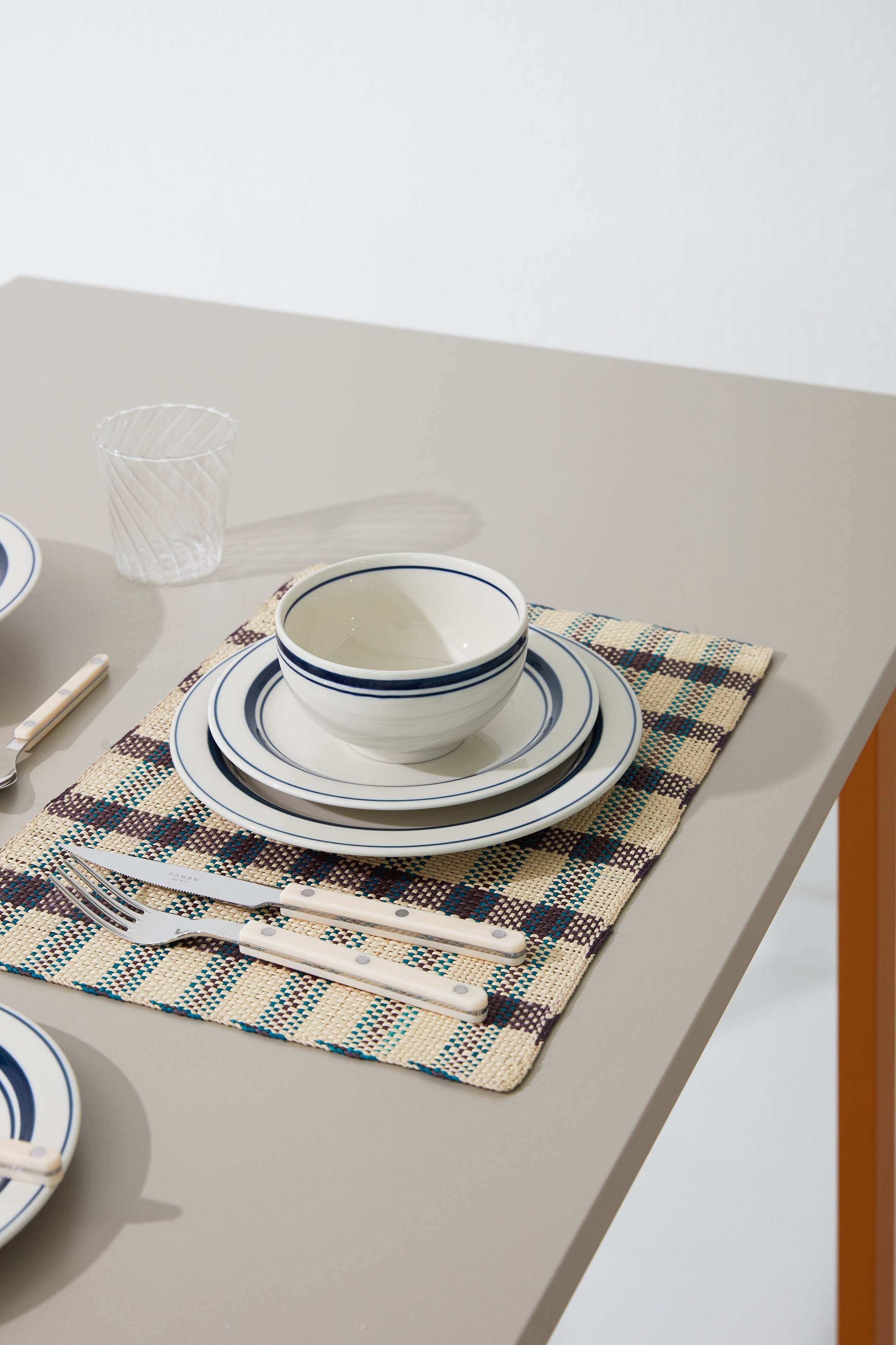Japanese ceramic plates and bowl with blue rim on a table setting – Studio Hafnia