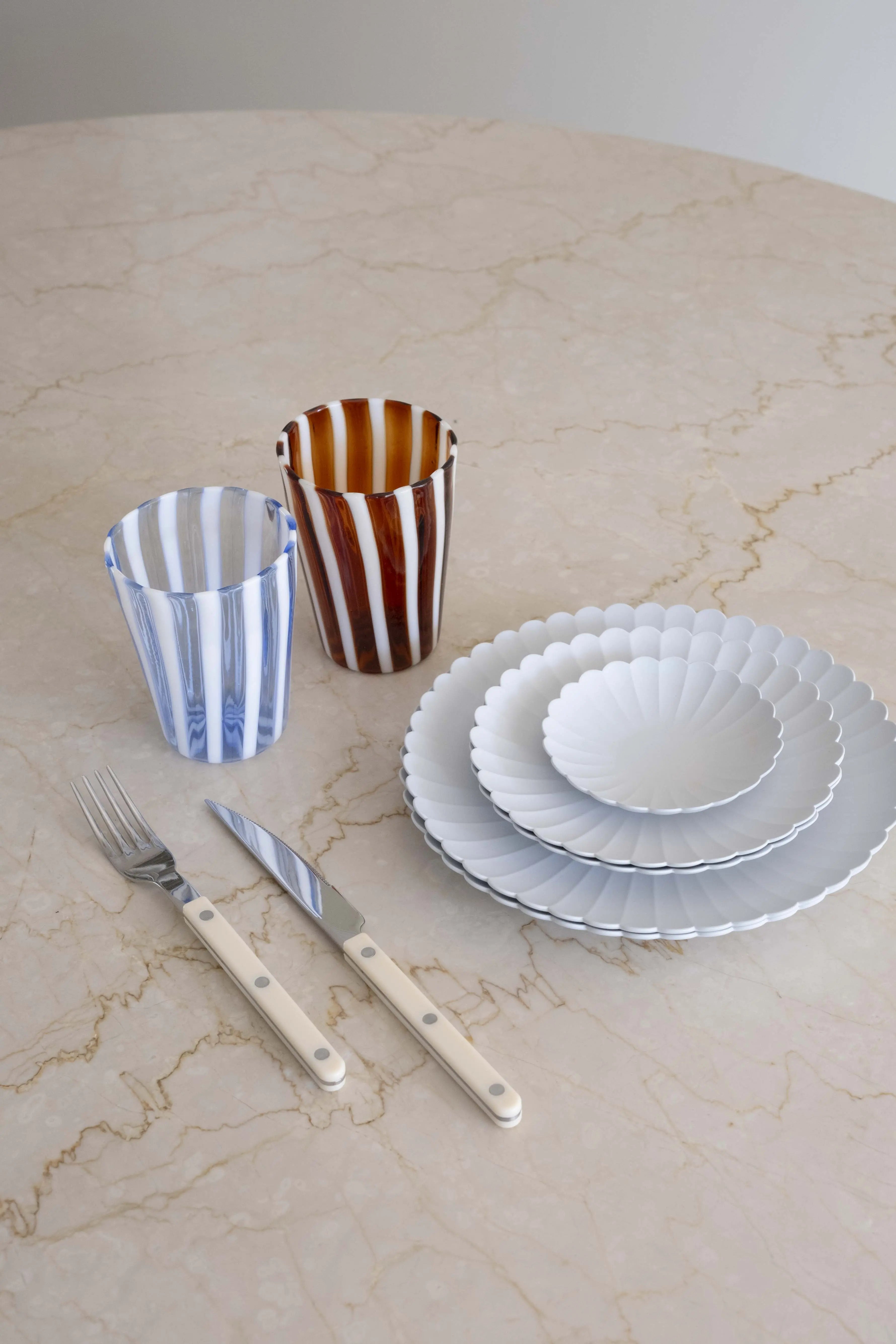 Studio Hafnia collection table setting with Arita Japan plates, Sabre Paris cutlery, and hand-blown Murano drinking glasses