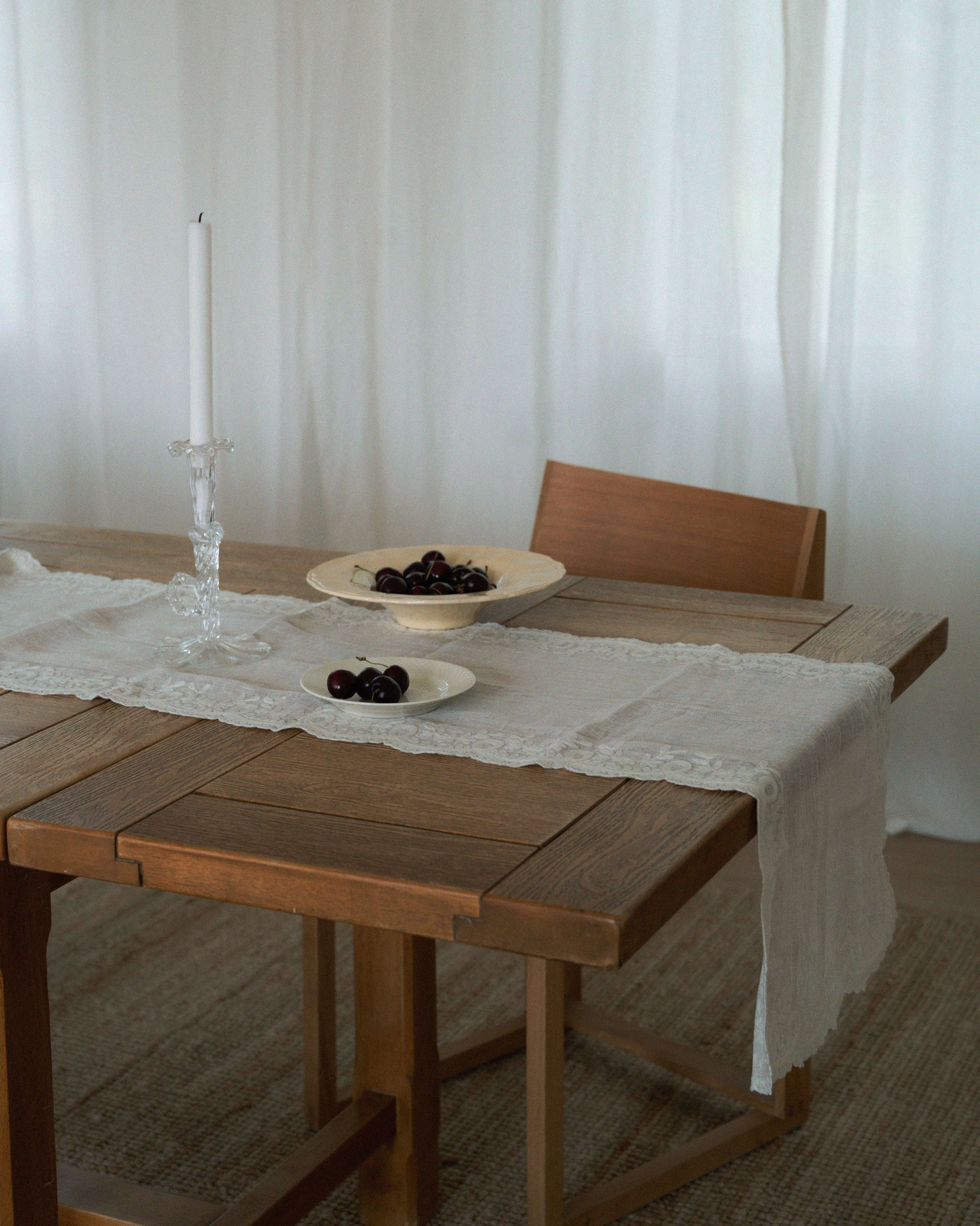 Anne-mi white linen table runner with lace detail on wooden dining table – Studio Hafnia