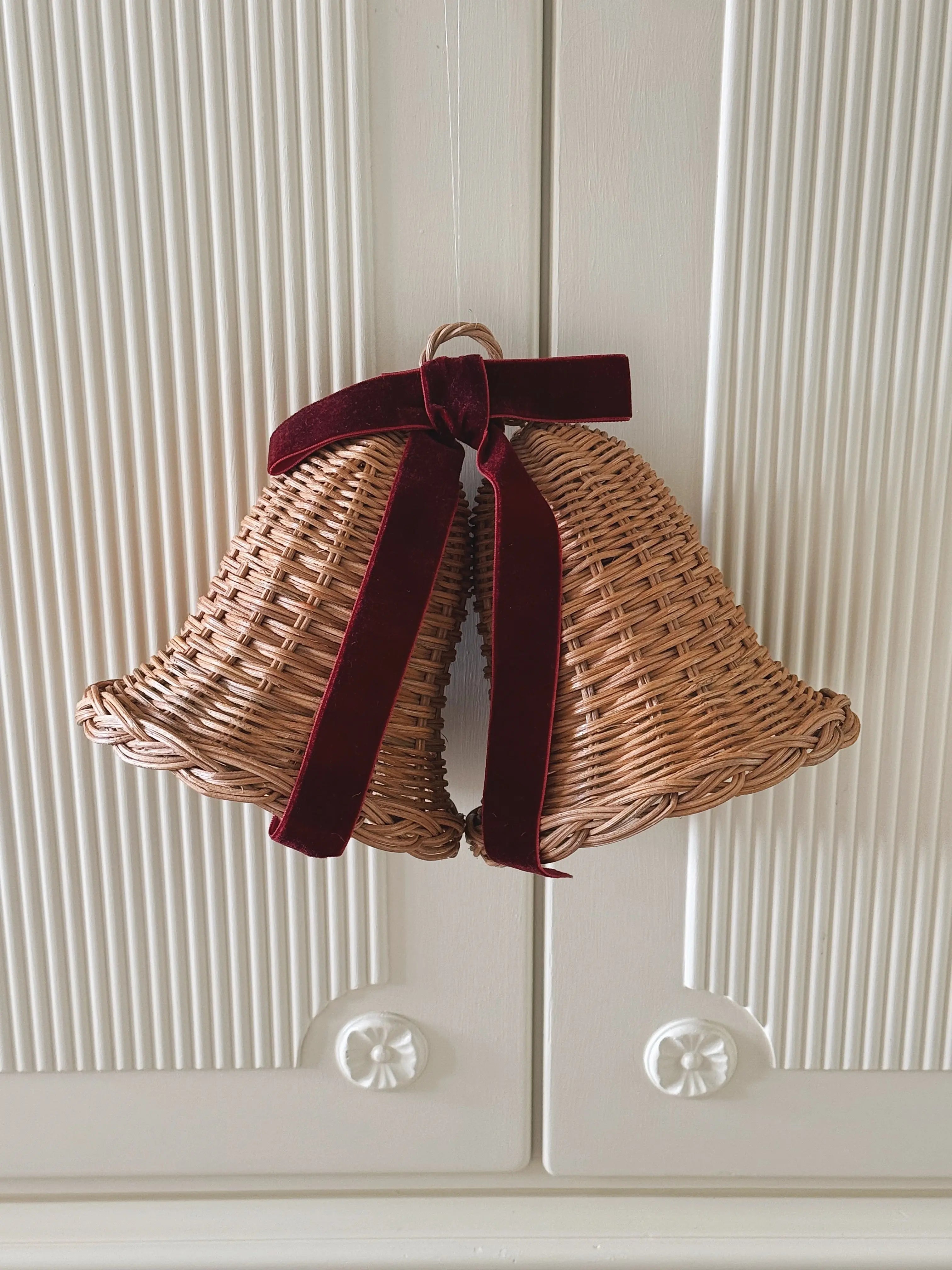 Handmade rattan Christmas bells with ribbon bow – natural holiday ornament from Studio Hafnia