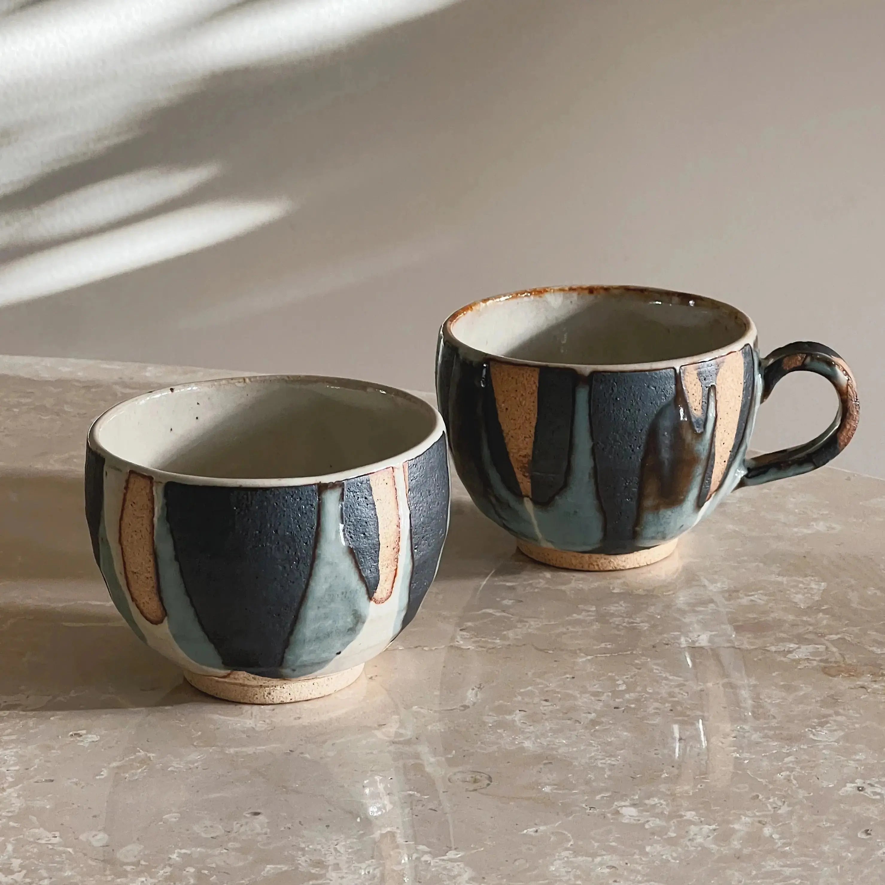 Handmade Japanese ceramic cup and mug with unique glaze, available at Studio Hafnia