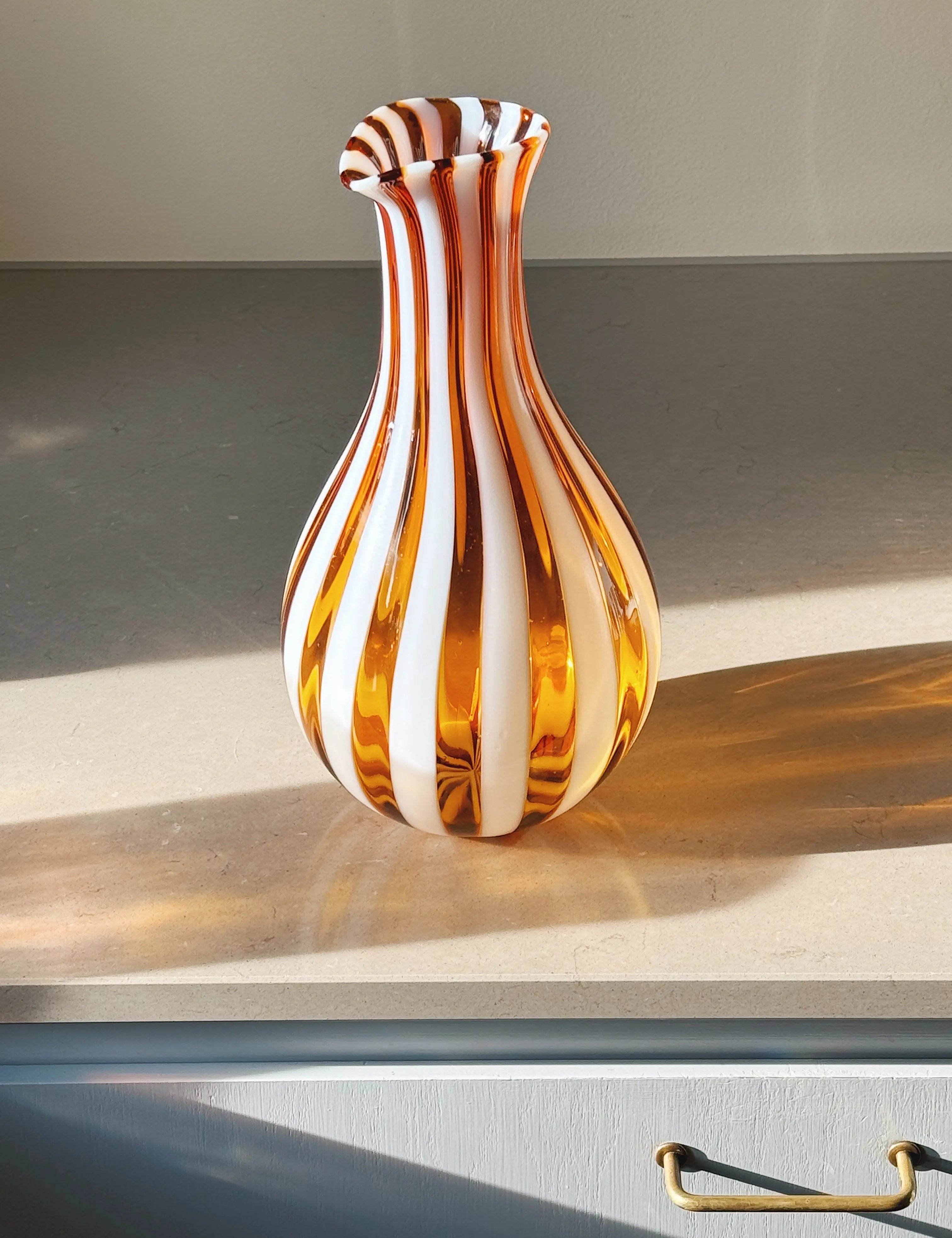 Hand-blown Murano glass carafe with orange and white striped design – unique Italian jug for serving water, wine or flowers.