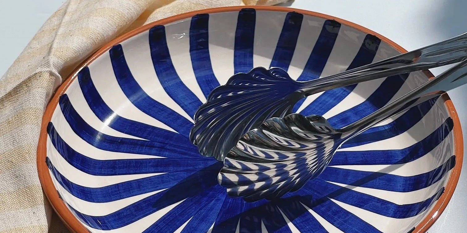 Casa Cubista Ray dish in terracotta with hand-painted blue and white stripes