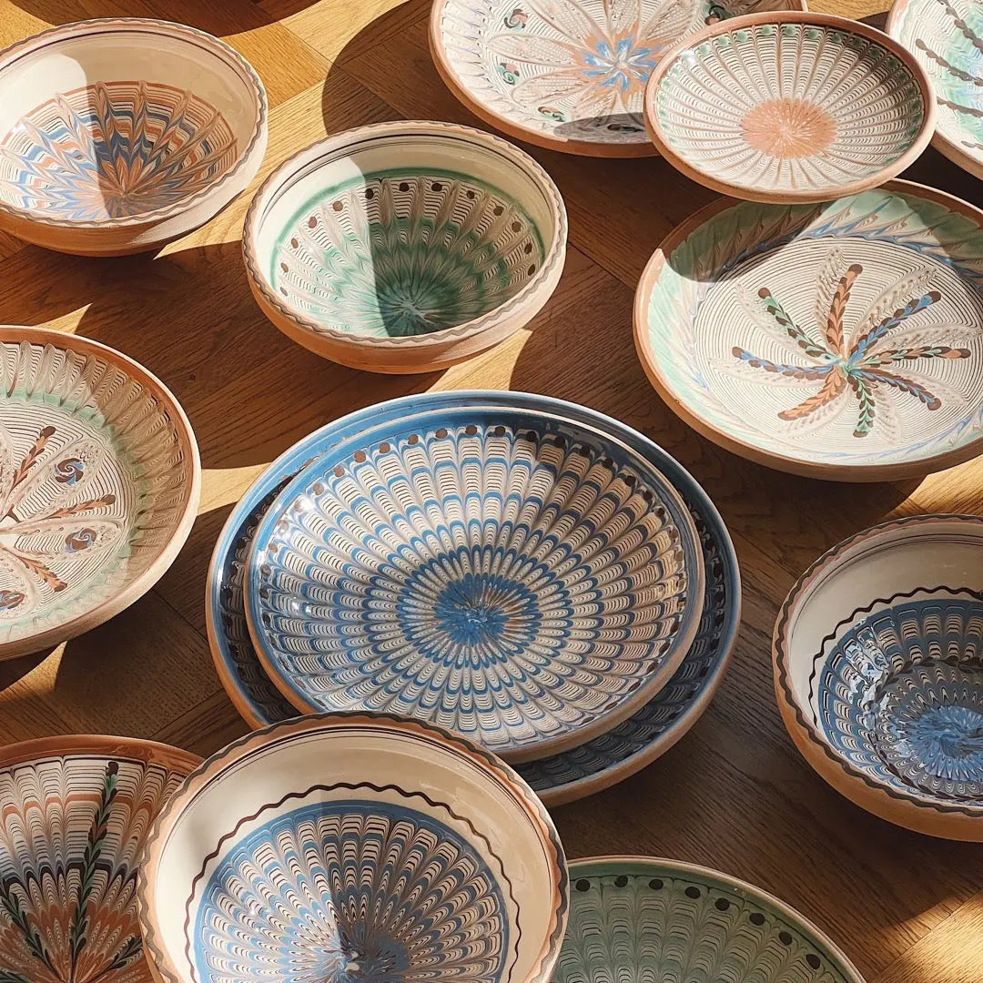 Hand painted Horezu pottery bowls from Romania in different sizes and patterns – traditional UNESCO recognised ceramic craftsmanship.