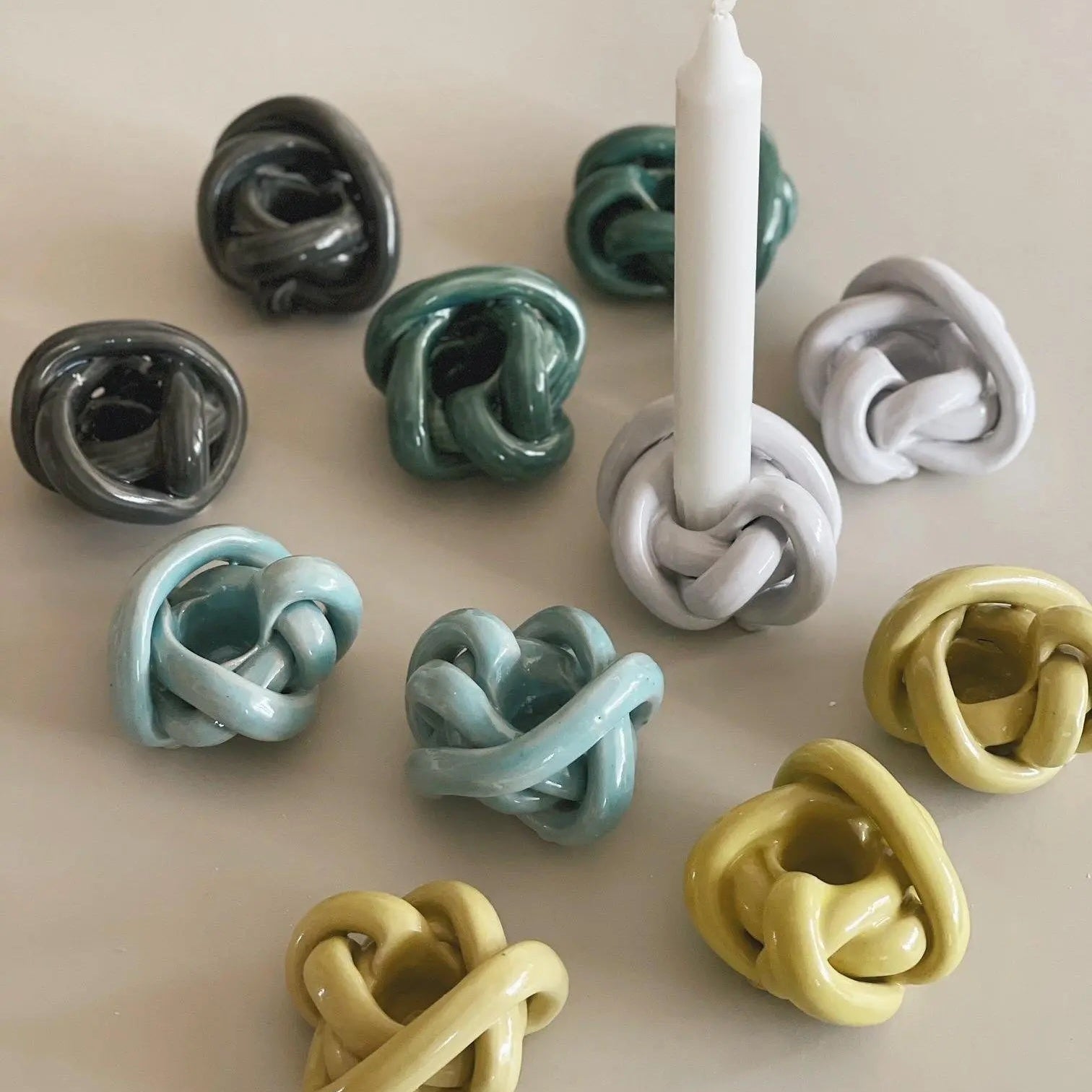 Anna Wadle handmade ceramic knot candle holders in multiple colors – Scandinavian design in stoneware
