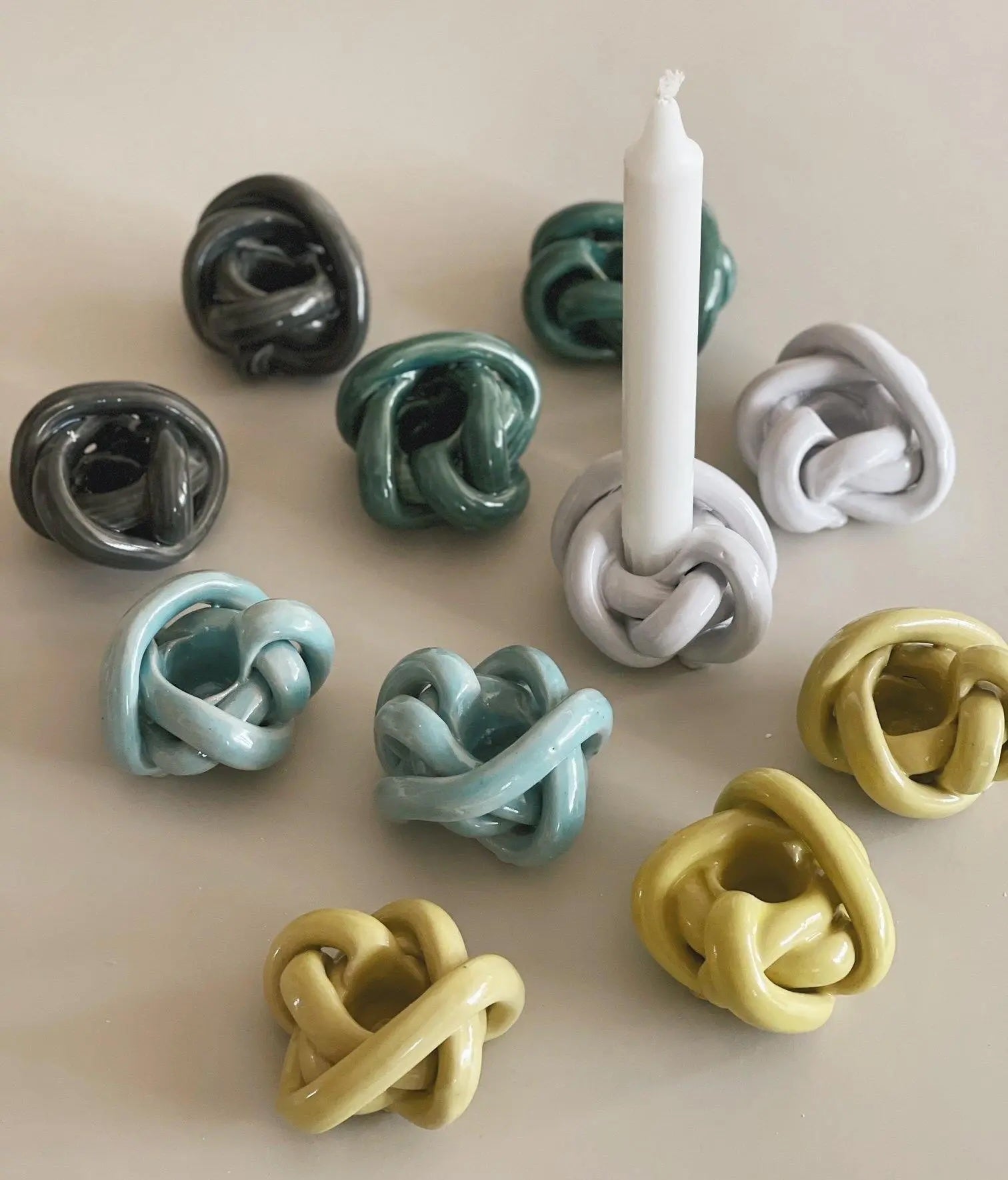 Anna Wadle handmade ceramic knot candle holders in multiple colors – Scandinavian design in stoneware