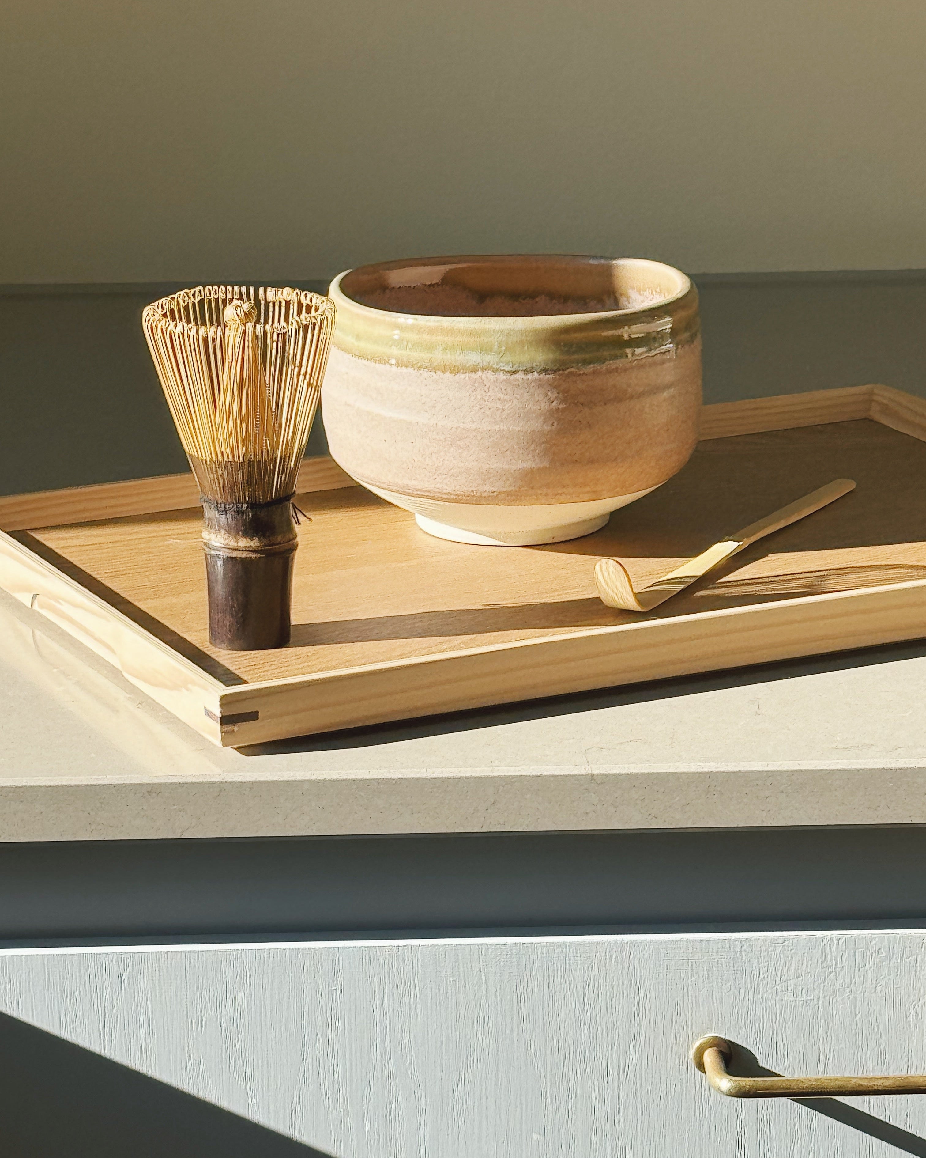 Matcha bowl with bamboo whisk and scoop on a wooden tray – Japanese matcha accessories