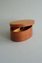 Shaker Sewing Box in cherry wood – oval sewing box with lid and visible wood grain