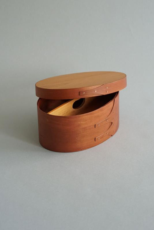 Shaker Sewing Box in cherry wood – oval sewing box with lid and visible wood grain