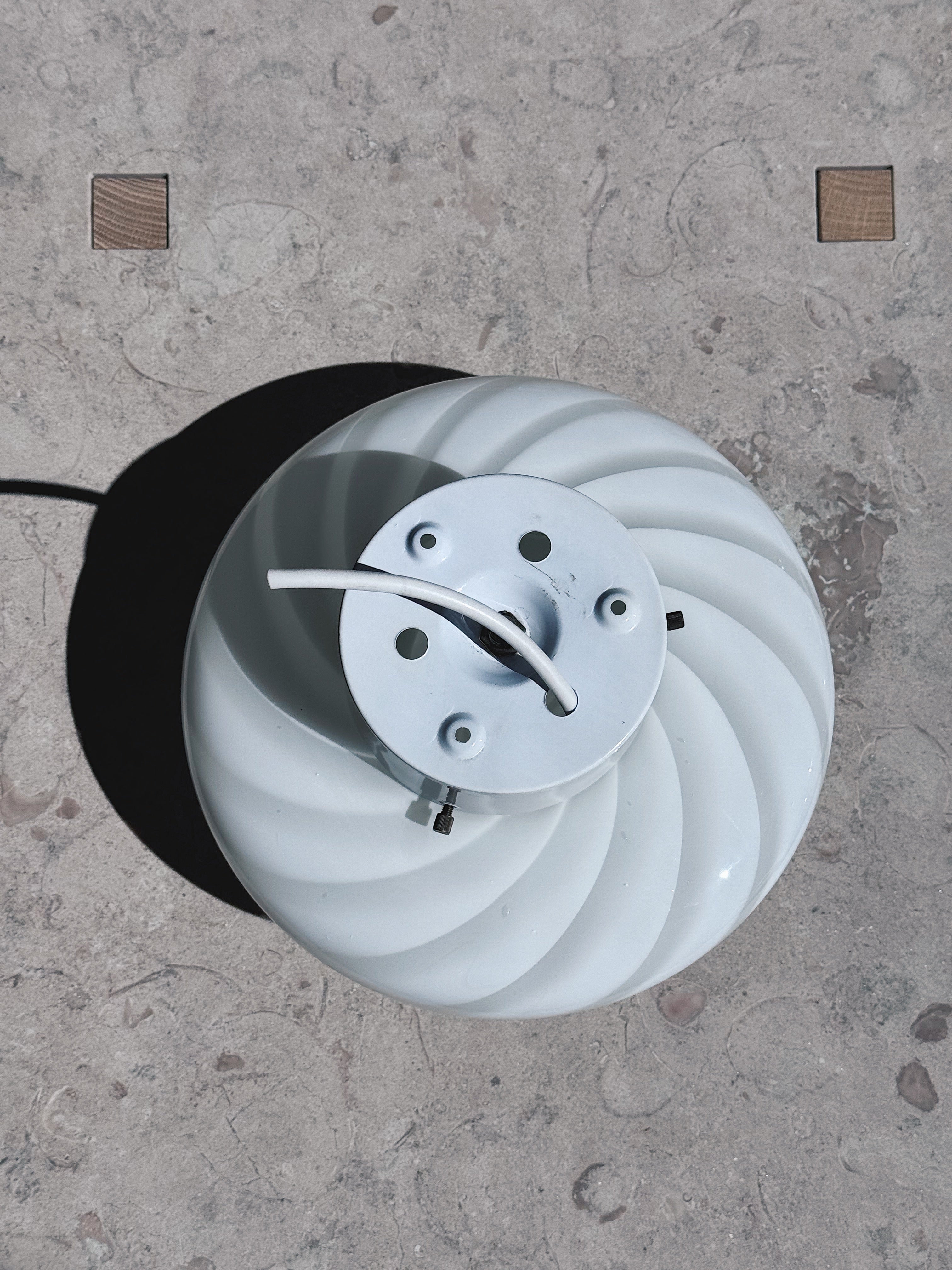Detail of the swirl pattern in white opal glass on Murano flush mount