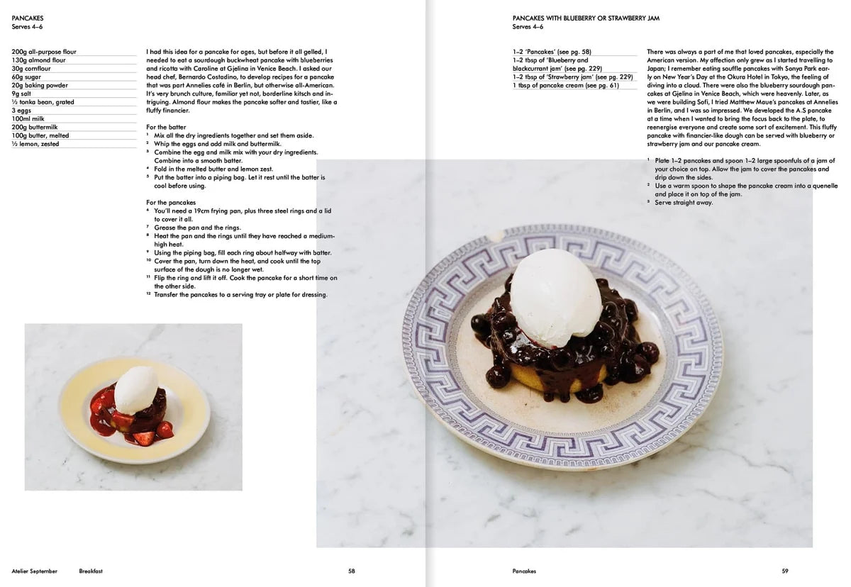 Recipe for pancakes with blueberry jam and whipped cream on a plate with a Greek key pattern