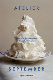 Atelier September cookbook by Frederik Bille Brahe with a swirl of whipped cream on a patterned plate on the cover