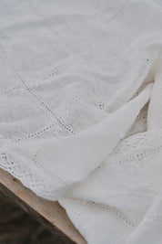 Close-up of embroidered linen from the Anne-Mi Skovbjerg series in white sand, Studio Hafnia