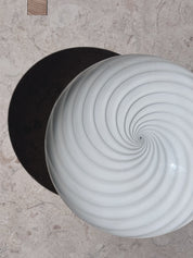White Murano swirl flush mount seen from above with spiral pattern in the centre