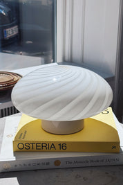 Vintage Murano ceiling light in white swirl glass photographed in window light