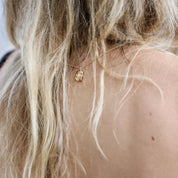 Inger necklace in solid 14 carat gold by Christina Iversen Studio worn with the pendant at the nape