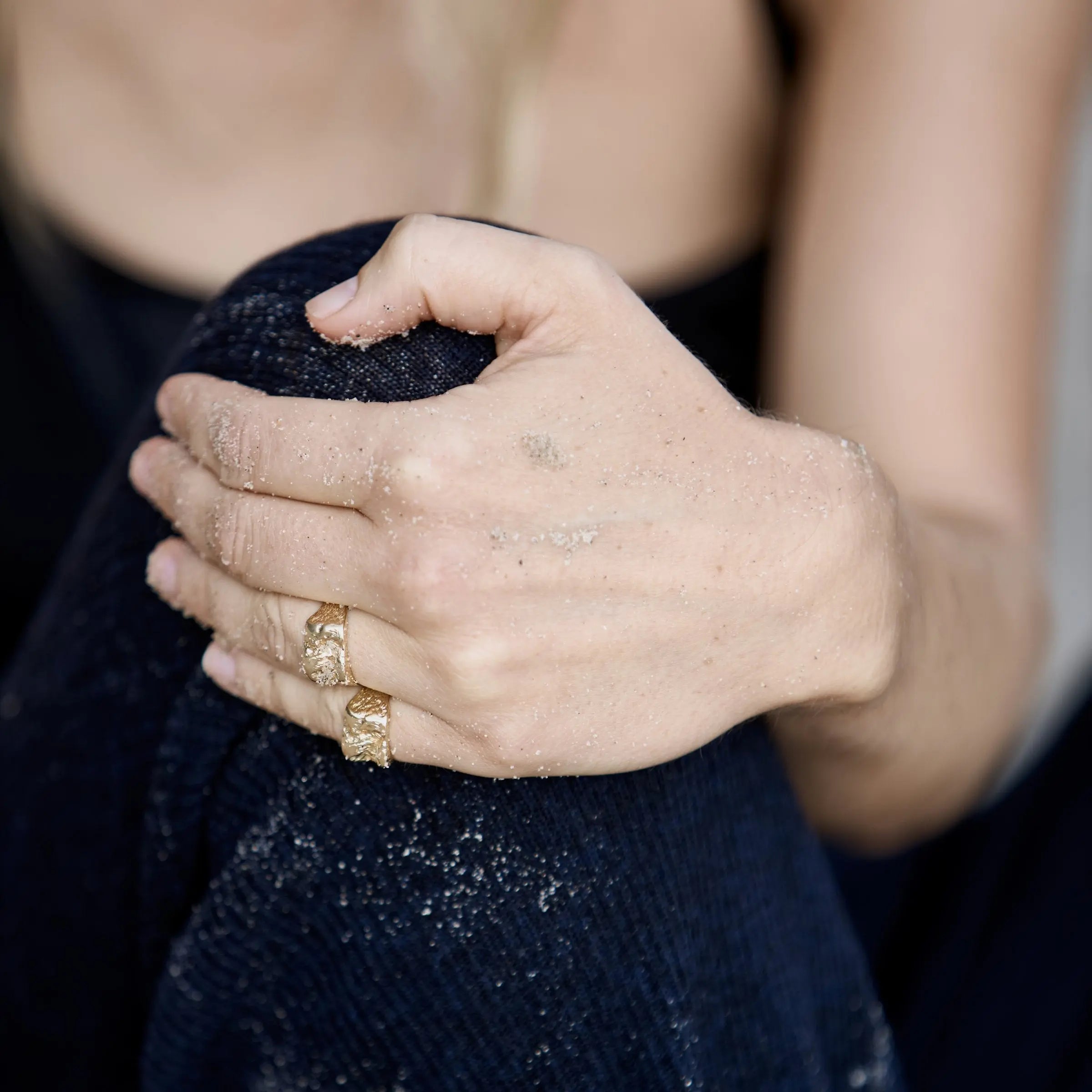 Inger ring in solid 14 carat gold by Christina Iversen Studio worn on the hand at the beach