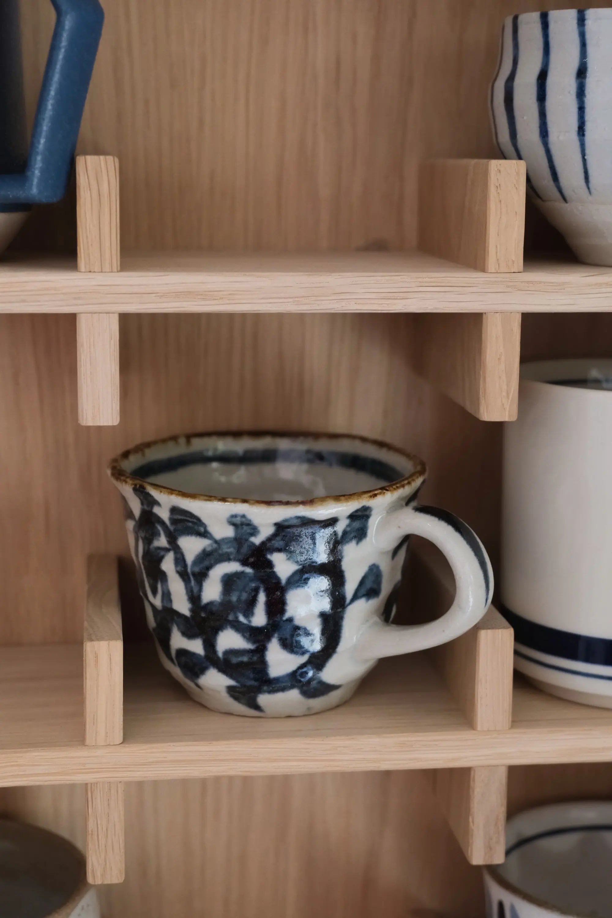 Japanese cup with hand painted blue pattern
