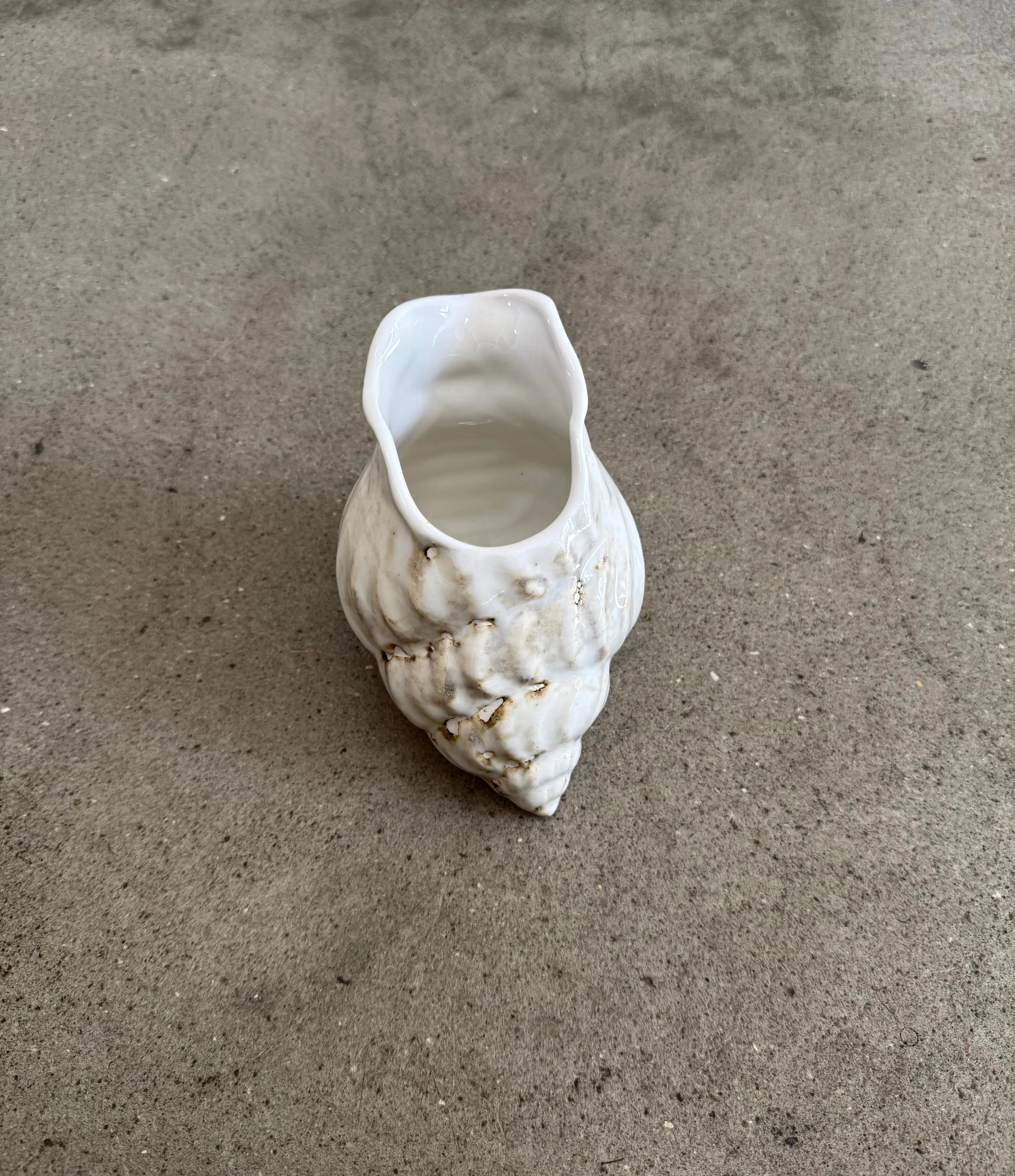 Conch Jug in cream glaze seen from the front - handmade ceramic designed by Dorte Kristoffersen