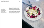 Recipe for burrata with radicchio served on a white plate on a marble table