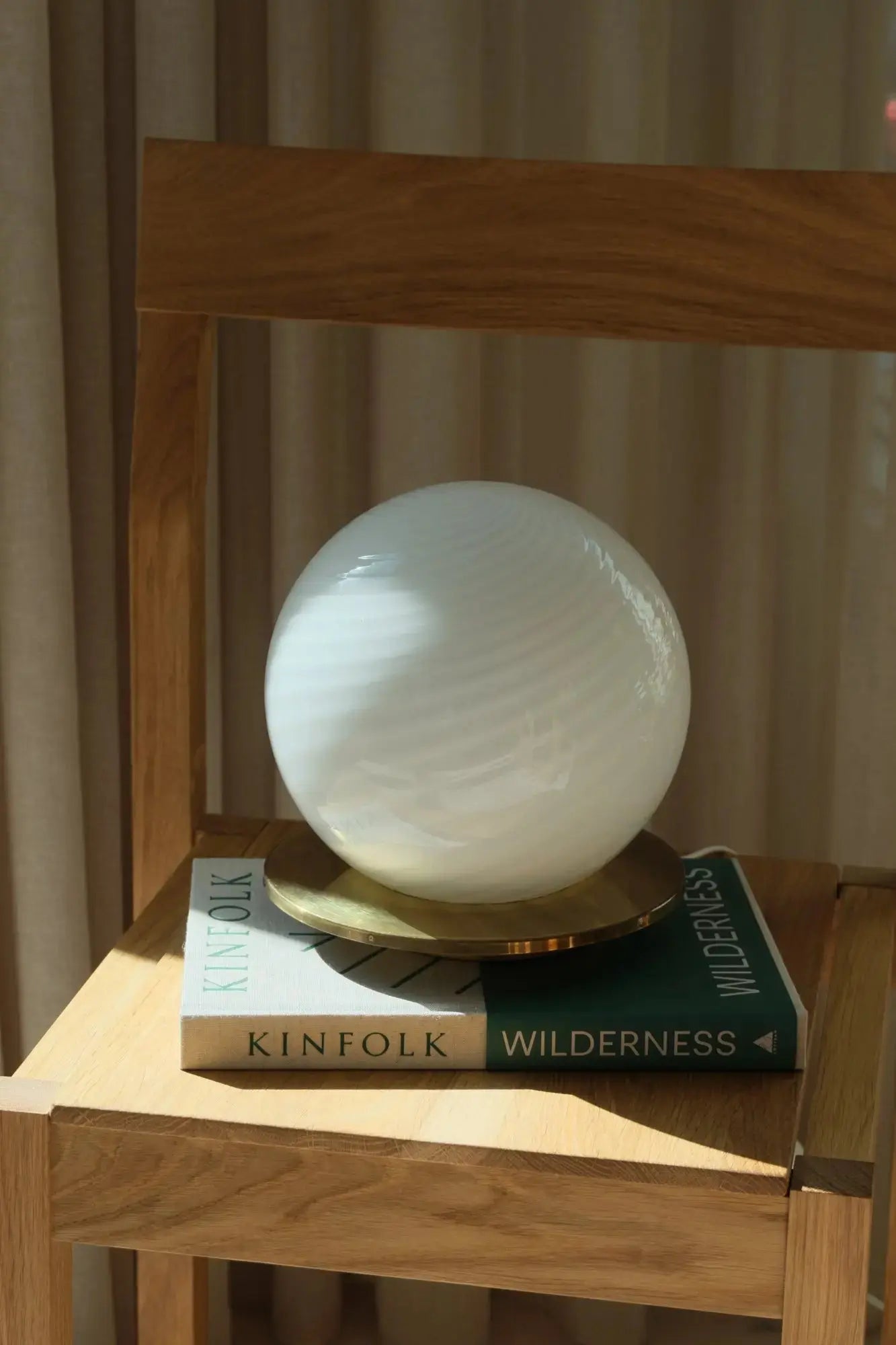 Close-up of the white swirl pattern in mouth-blown Murano glass on a vintage table lamp