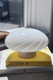 Vintage Murano ceiling light in white swirl glass photographed in window light