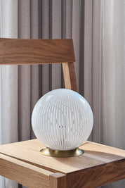 Murano filigrana table lamp H20 cm on an oak chair, with the polished brass base clearly visible
