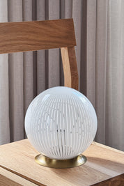 Vintage Murano table lamp in white filigrana glass seen from the side with polished brass foot