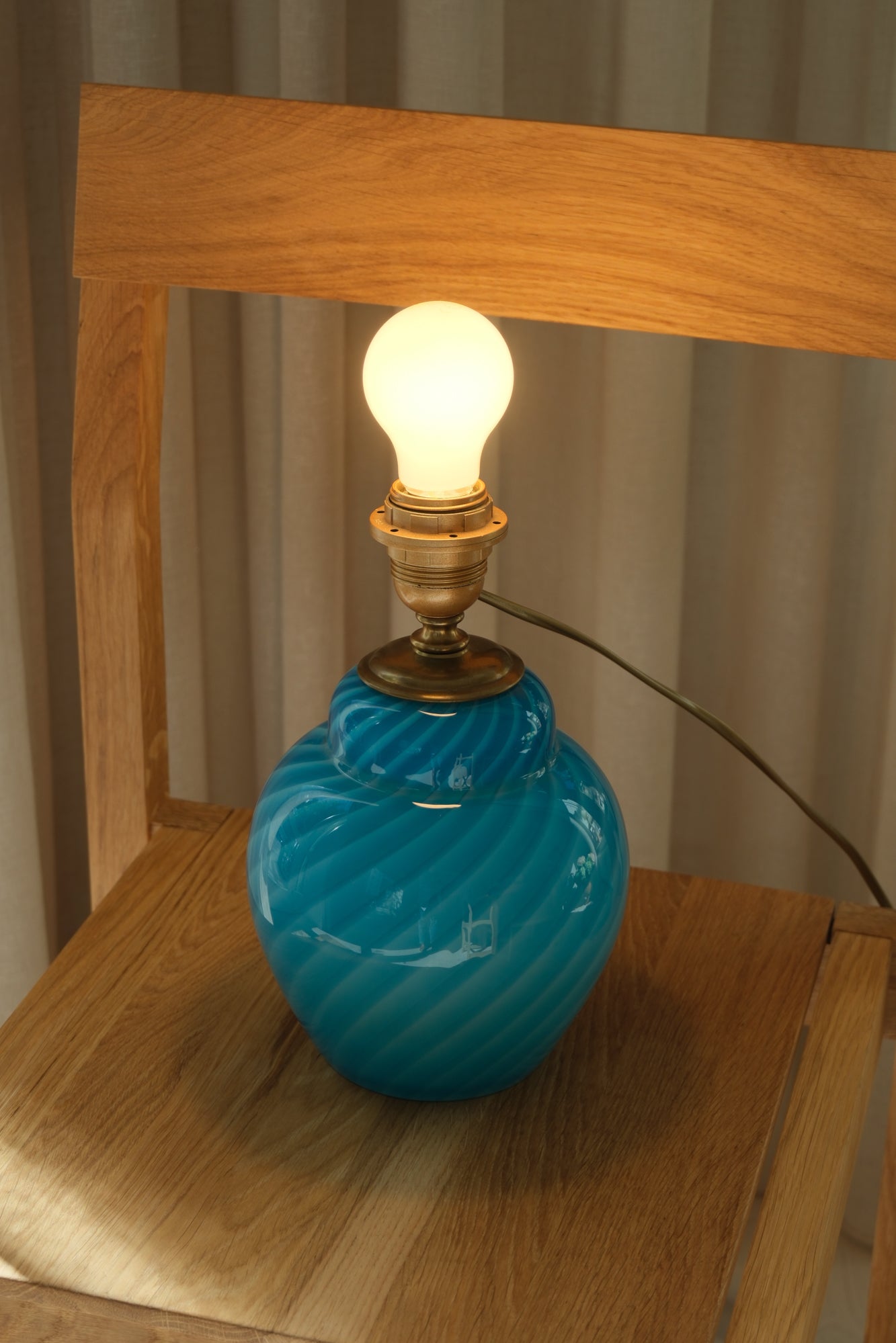 Mouth-blown Murano lamp base in azure blue glass with optic swirl pattern