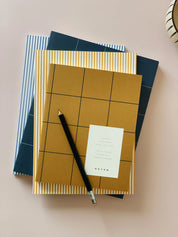 Notem studio, Uma notesbog flat lay, Softcover medium, Ochre Notem studio
