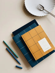Notem studio, Uma notesbog flat lay, Softcover medium, Ochre Notem studio